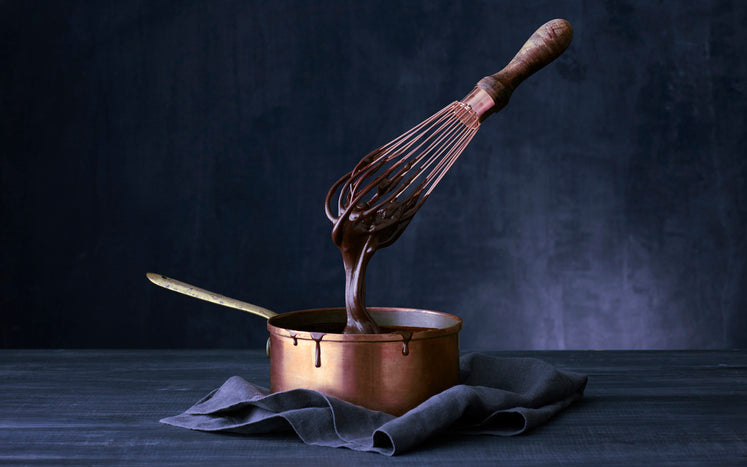 Copper pan with chocolate sauce